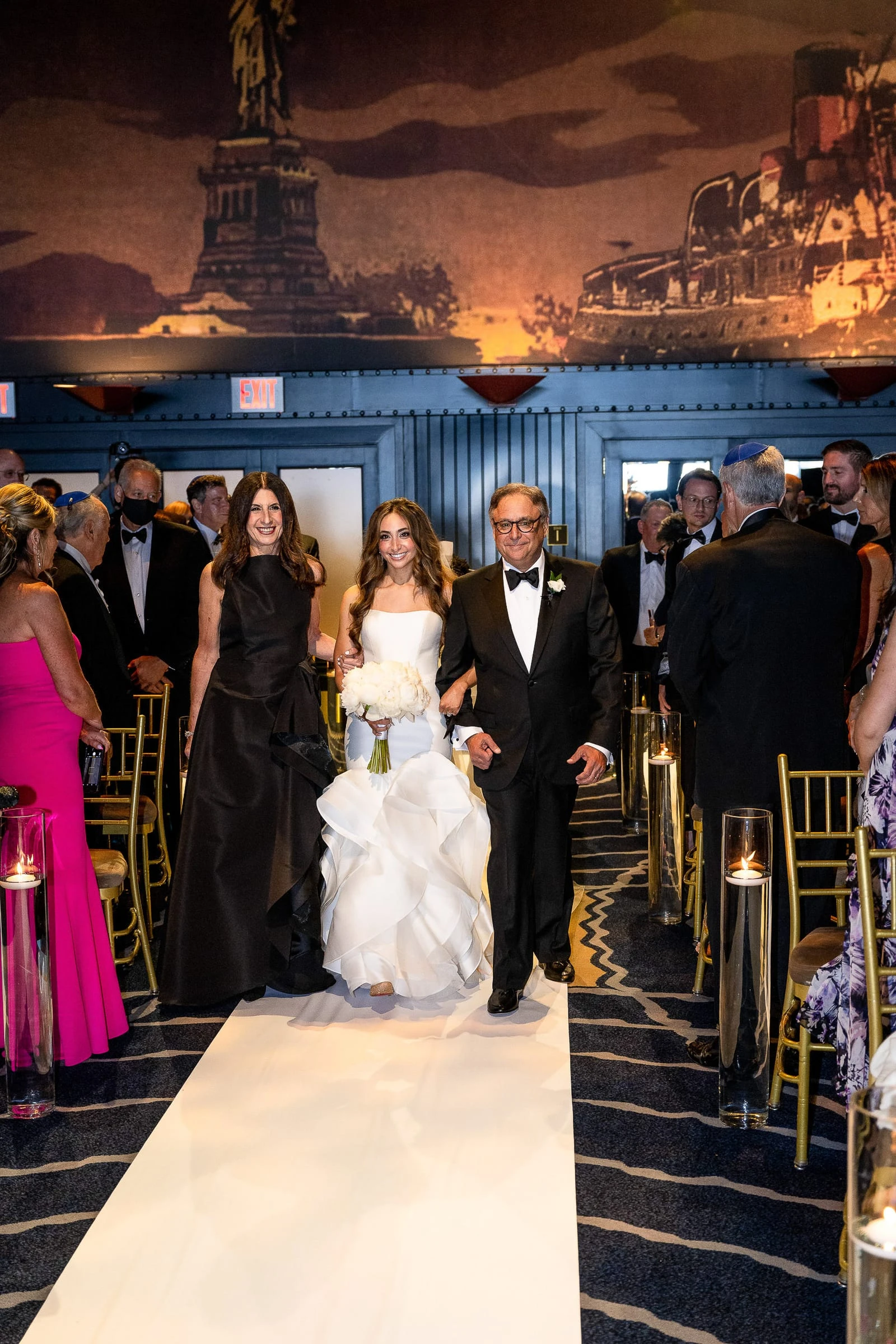 The bride walking the aisle between her parents — Casa Cipriani, New York