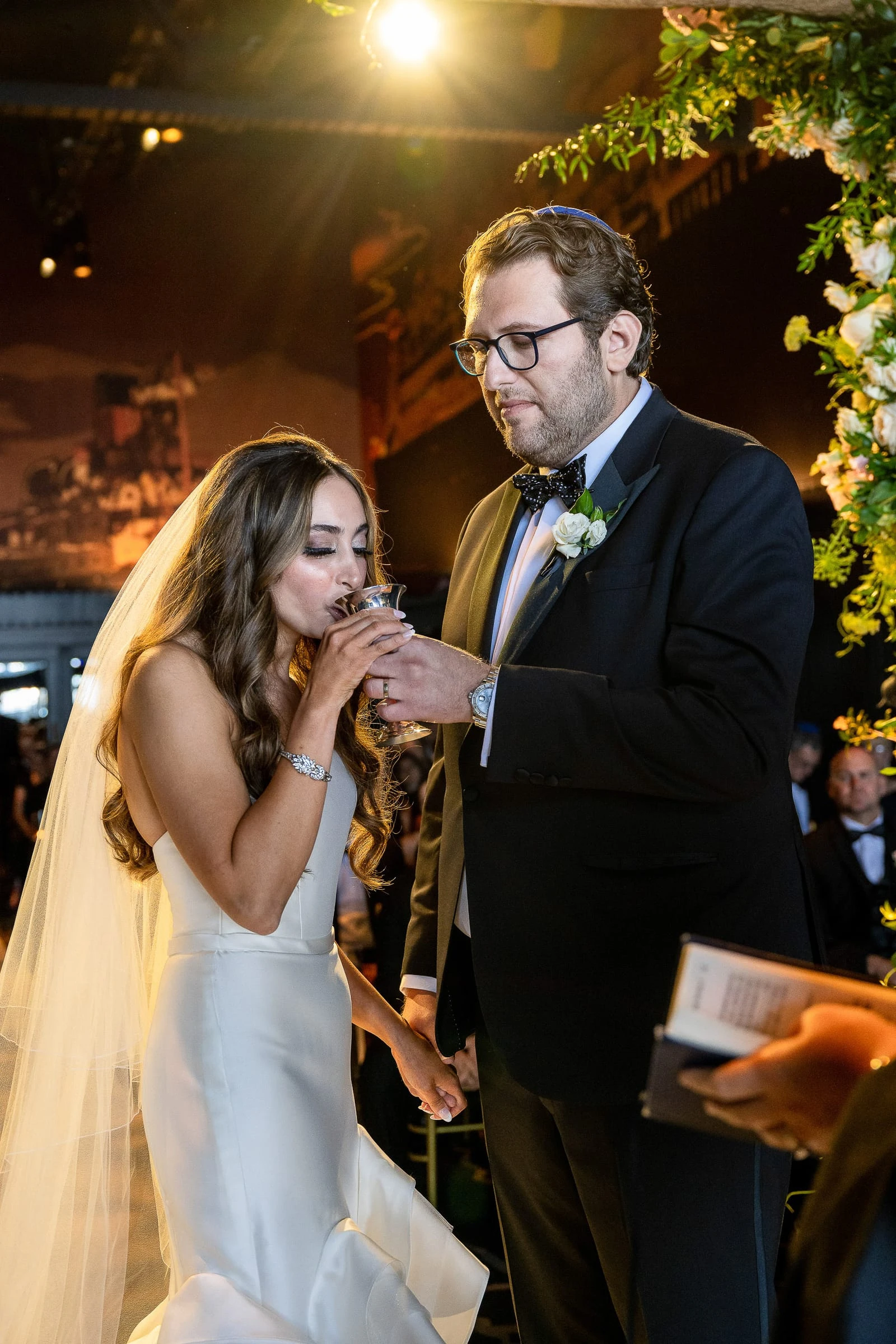 The bride drinking from the cup during the ceremony — Casa Cipriani, New York