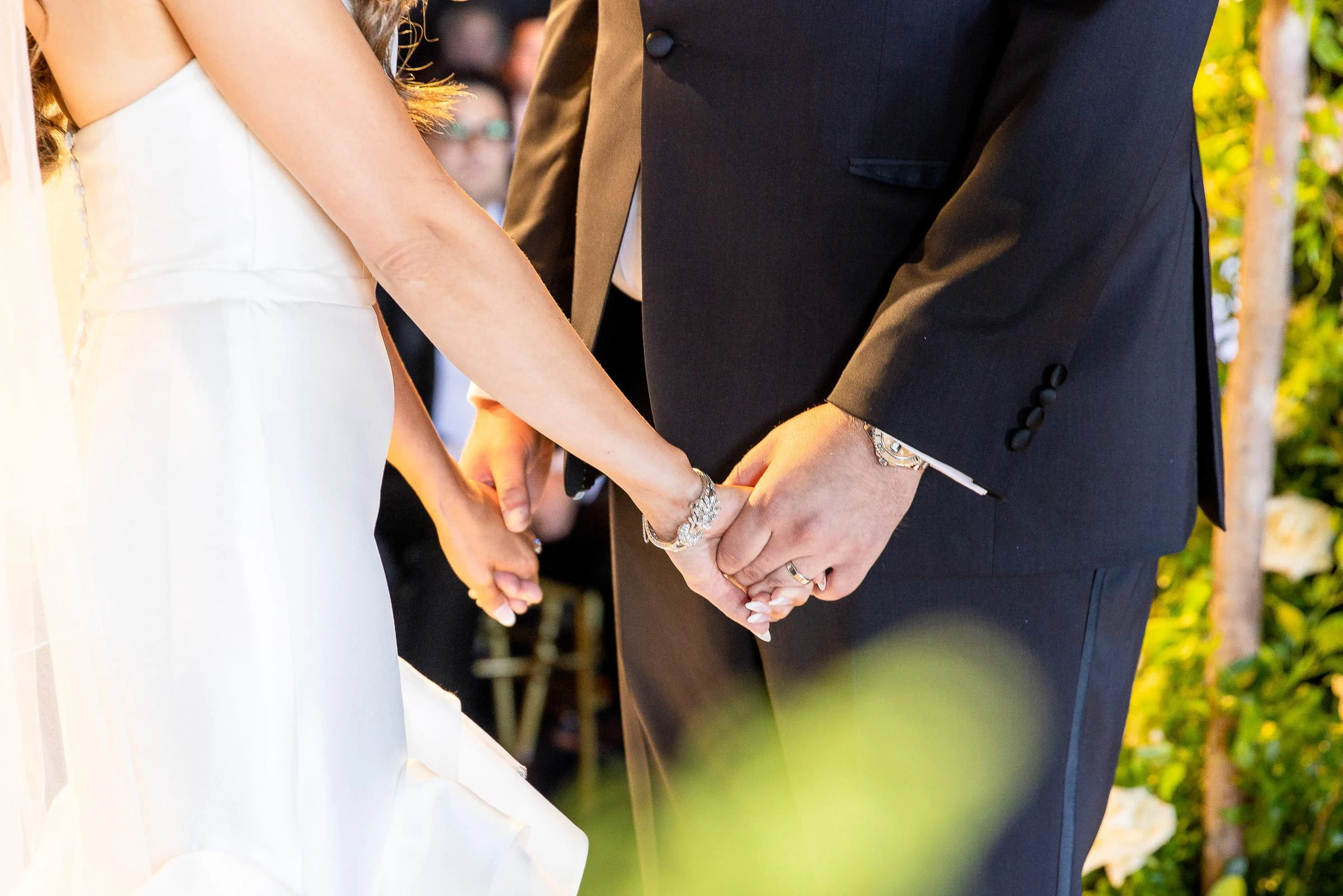 Their hands held together during the ceremony — Casa Cipriani, New York