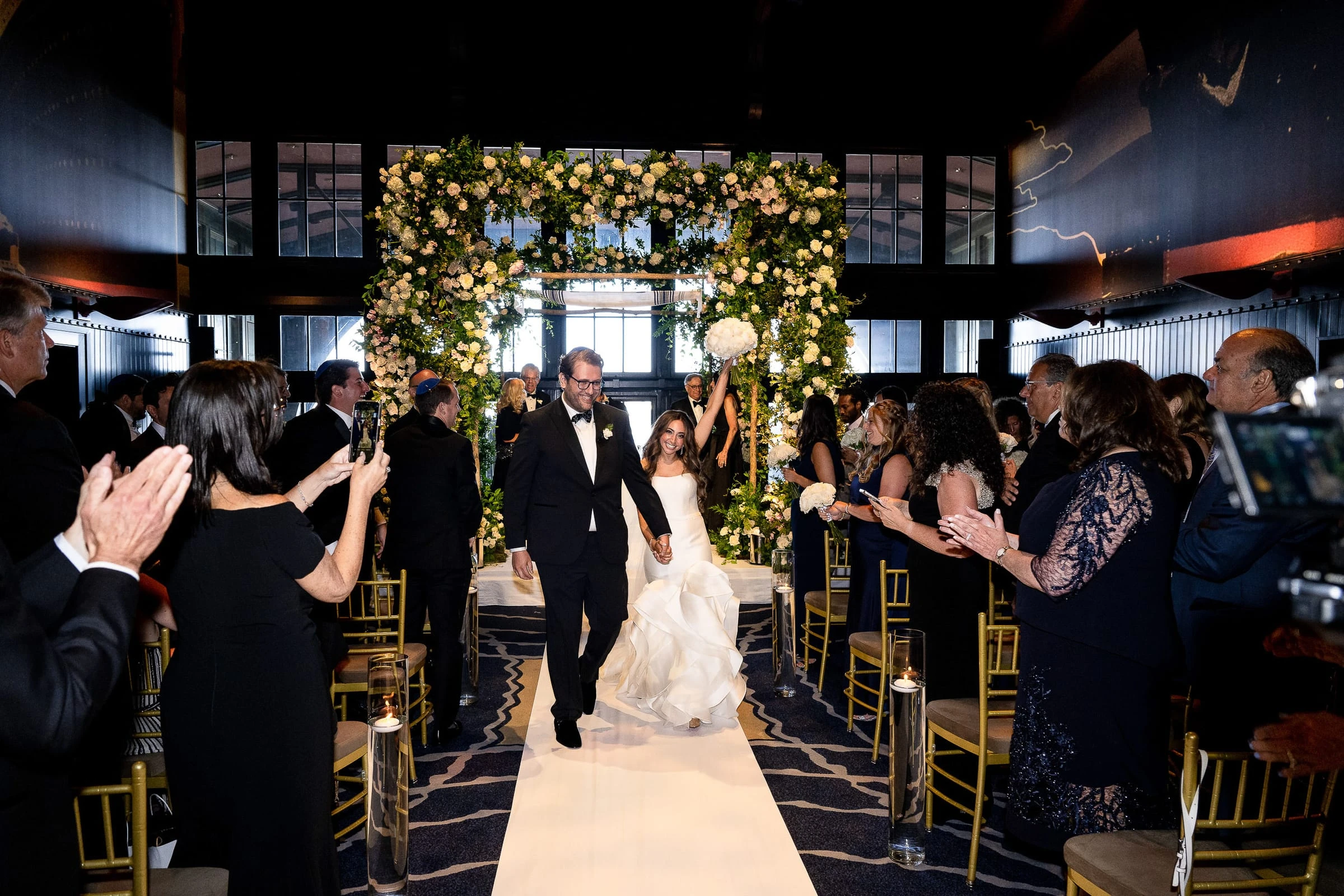 The recessional between applauding guests — Casa Cipriani, New York