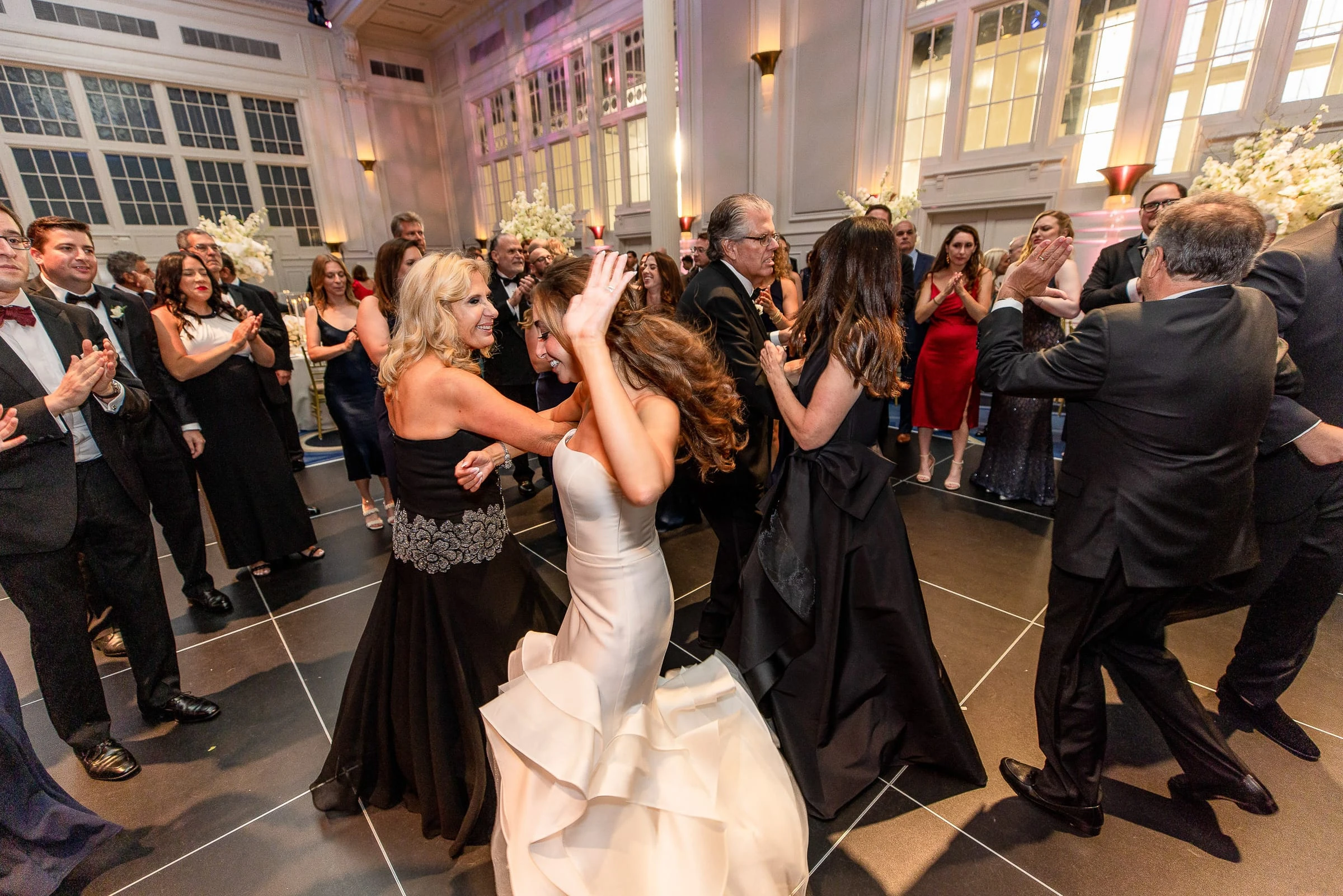 The bride dancing in a circle of guests — Casa Cipriani, New York