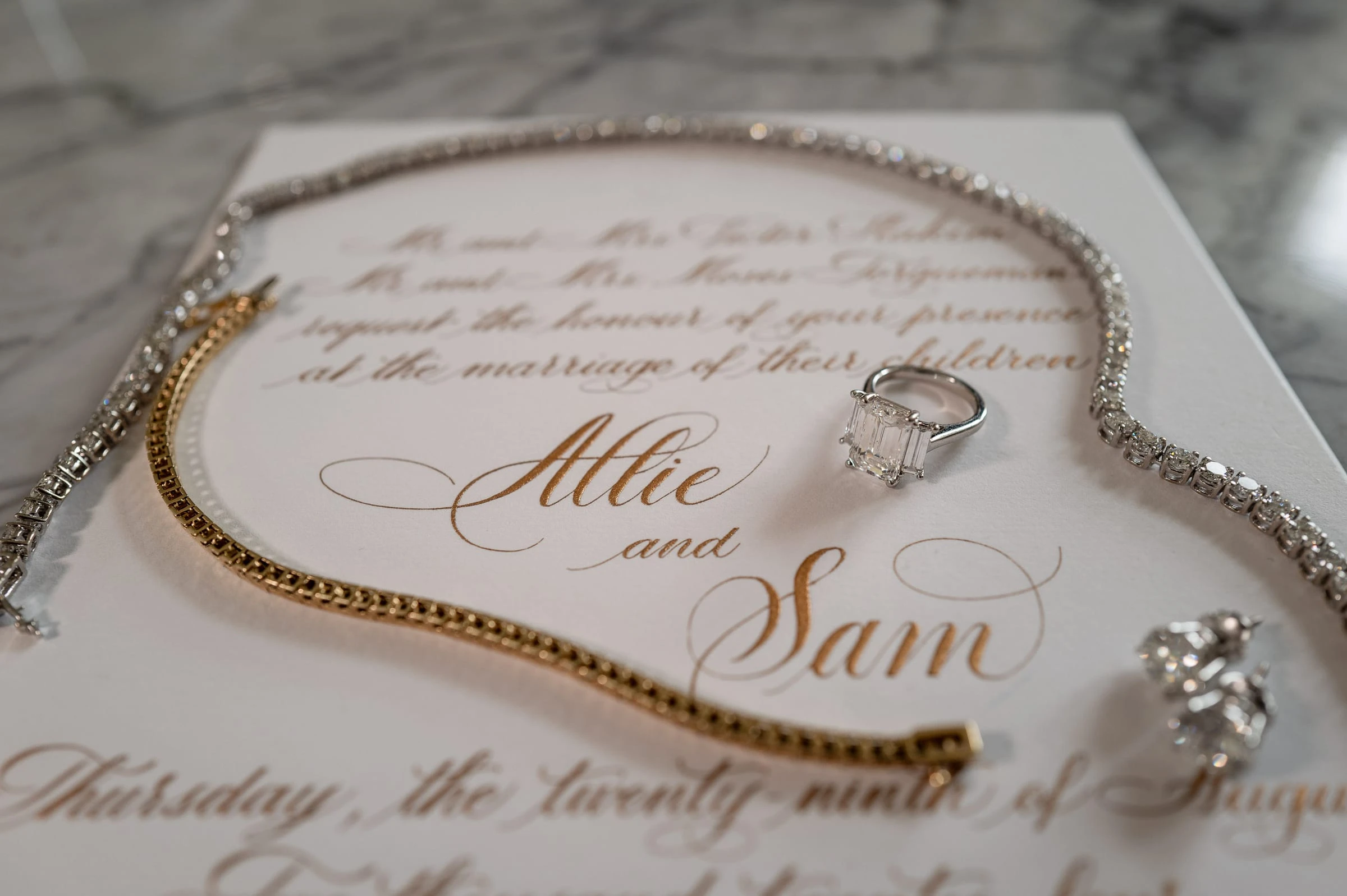 The invitation laid out with the rings and jewellery — Shadowbrook at Shrewsbury, Shrewsbury