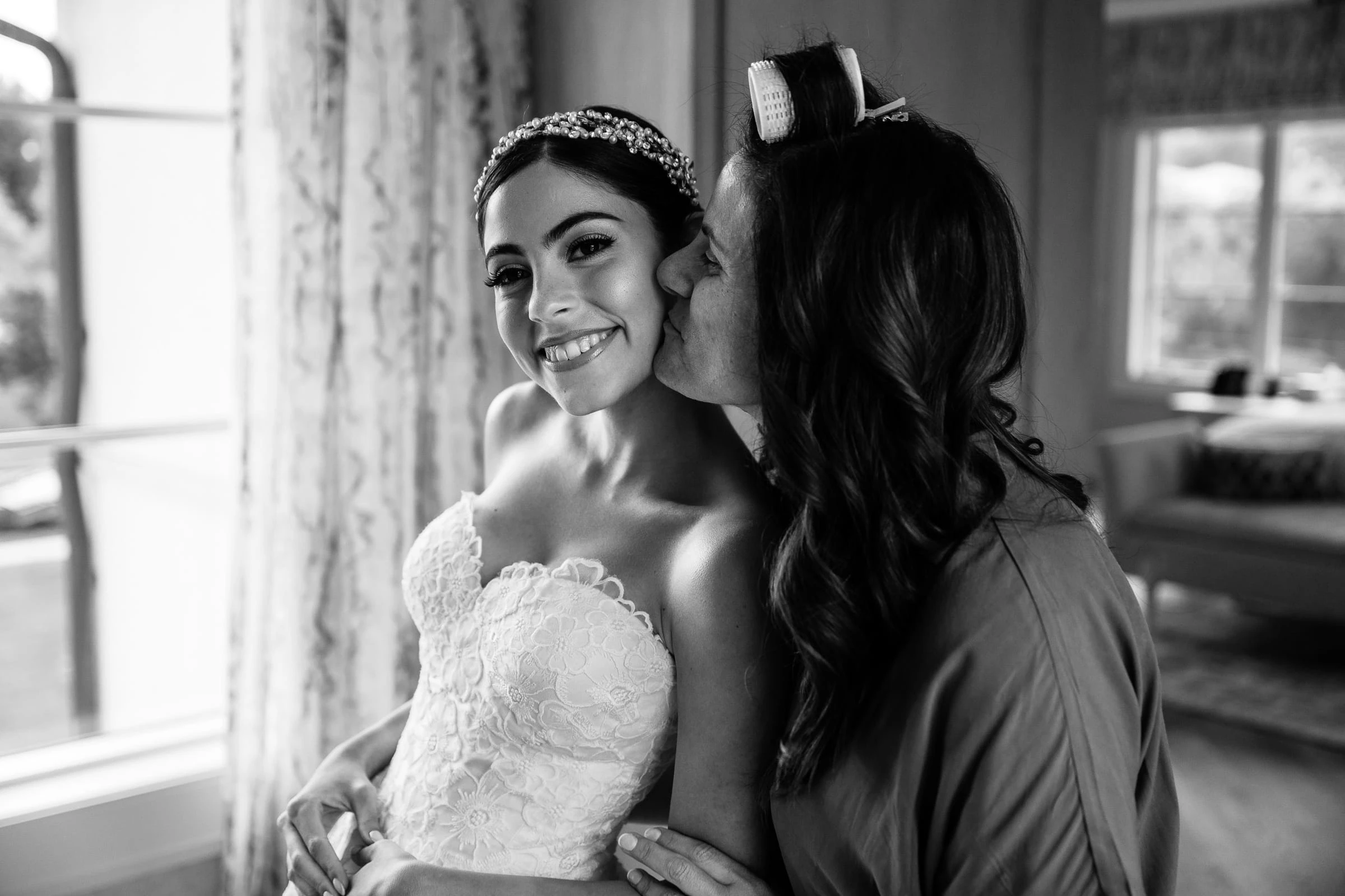 A kiss on the cheek before the ceremony, in black and white — Shadowbrook at Shrewsbury, Shrewsbury