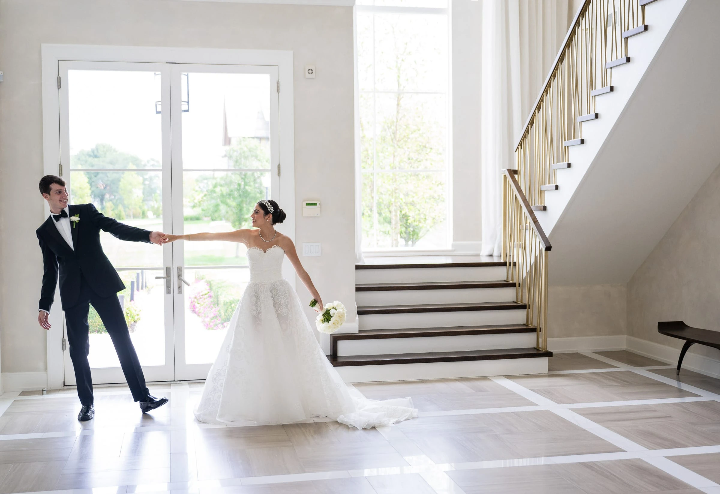 The couple turning together in the bright hall — Shadowbrook at Shrewsbury, Shrewsbury