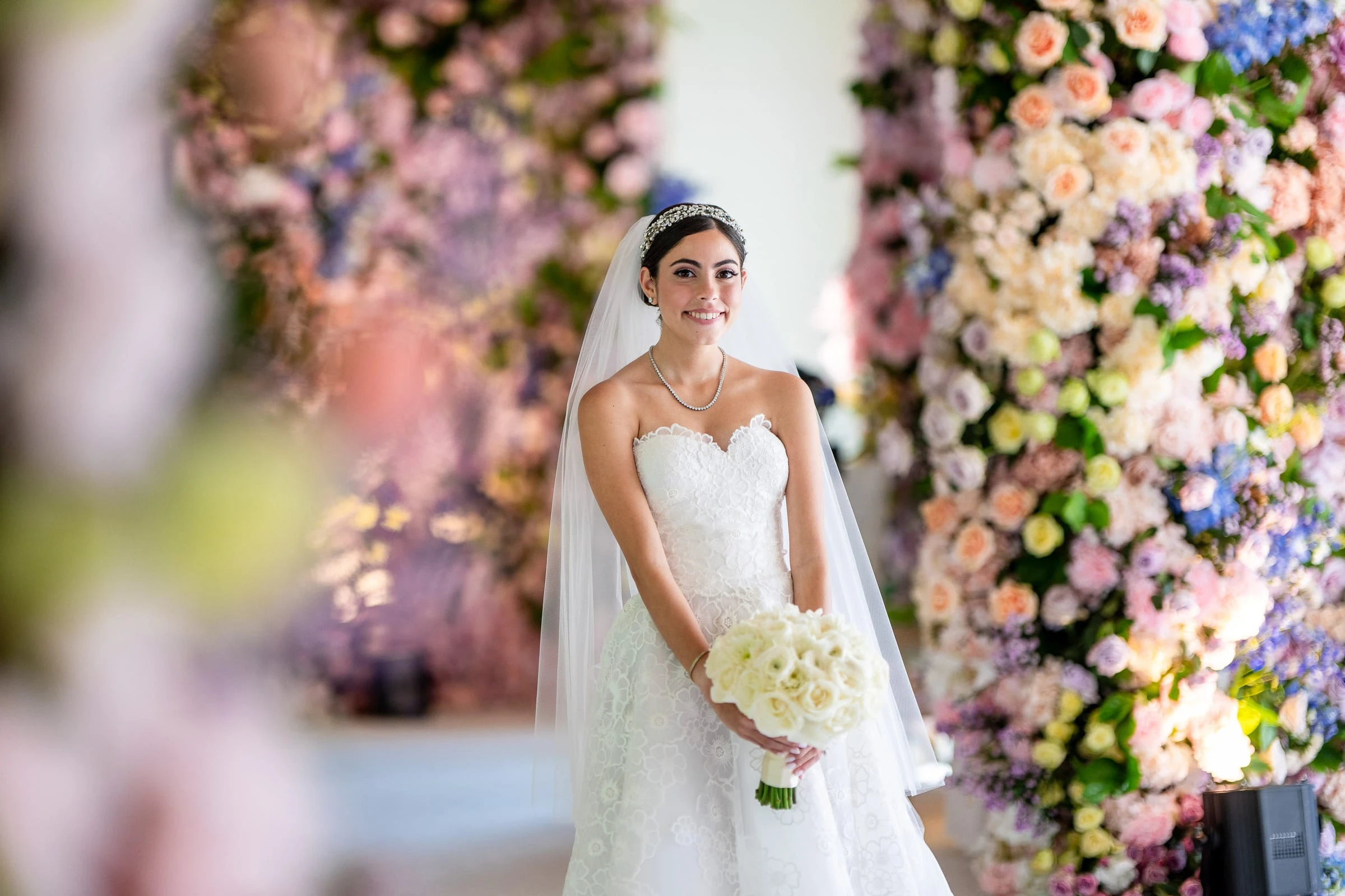 The bride framed by the flowers with her bouquet — Shadowbrook at Shrewsbury, Shrewsbury