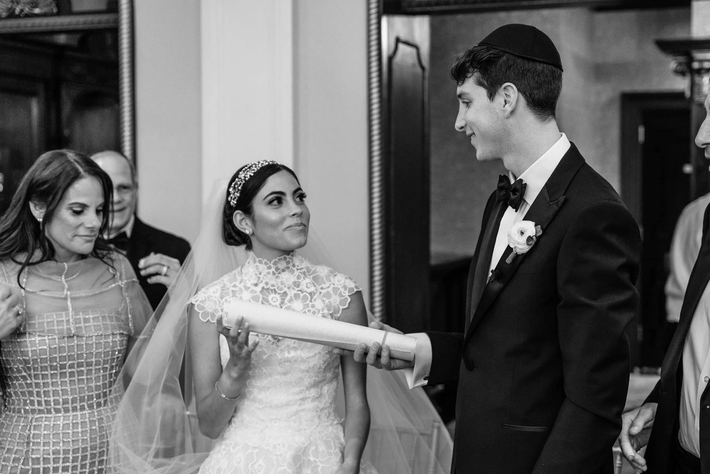 The bride holding the rolled ketubah facing the groom, in black and white — Shadowbrook at Shrewsbury, Shrewsbury