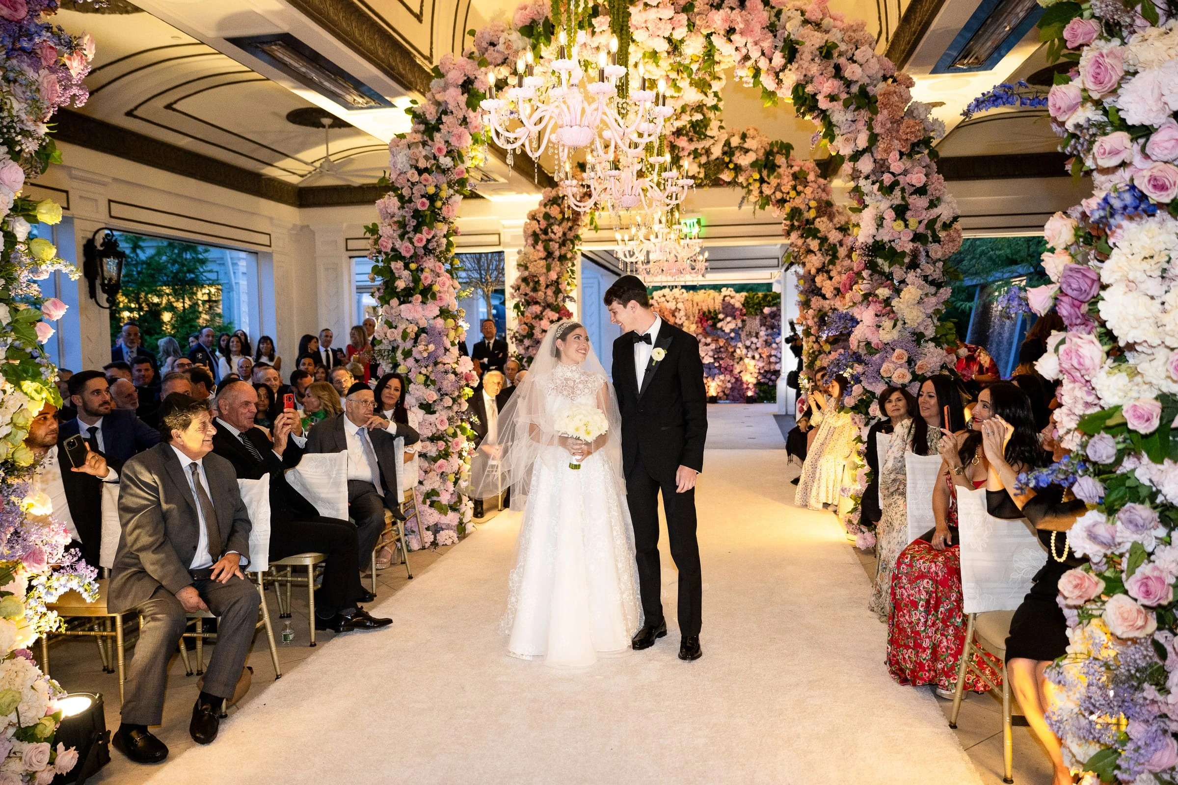 The couple together at the end of the flowered aisle — Shadowbrook at Shrewsbury, Shrewsbury