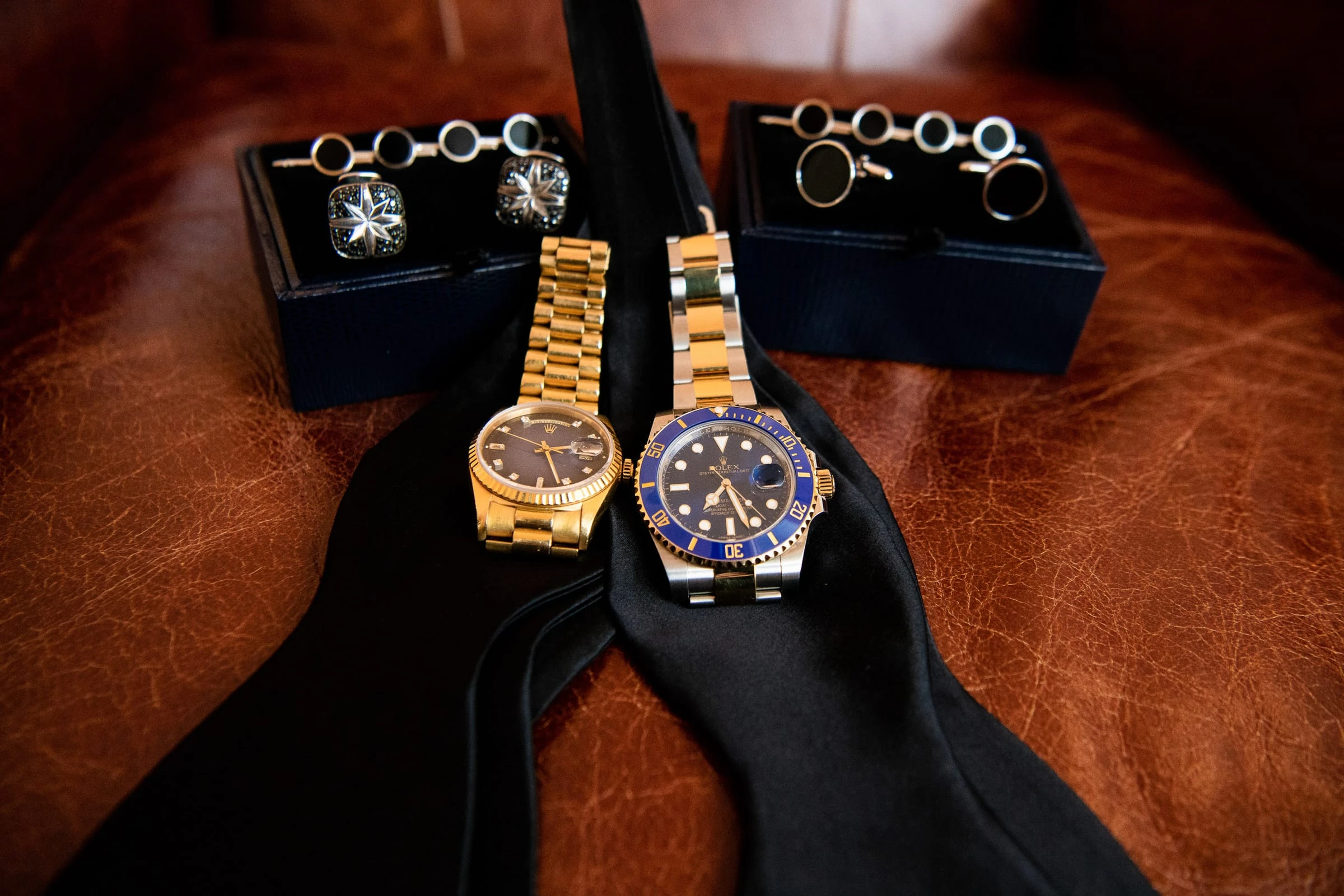Cufflinks, watches and bow ties laid out before dressing — Metropolitan Club, New York