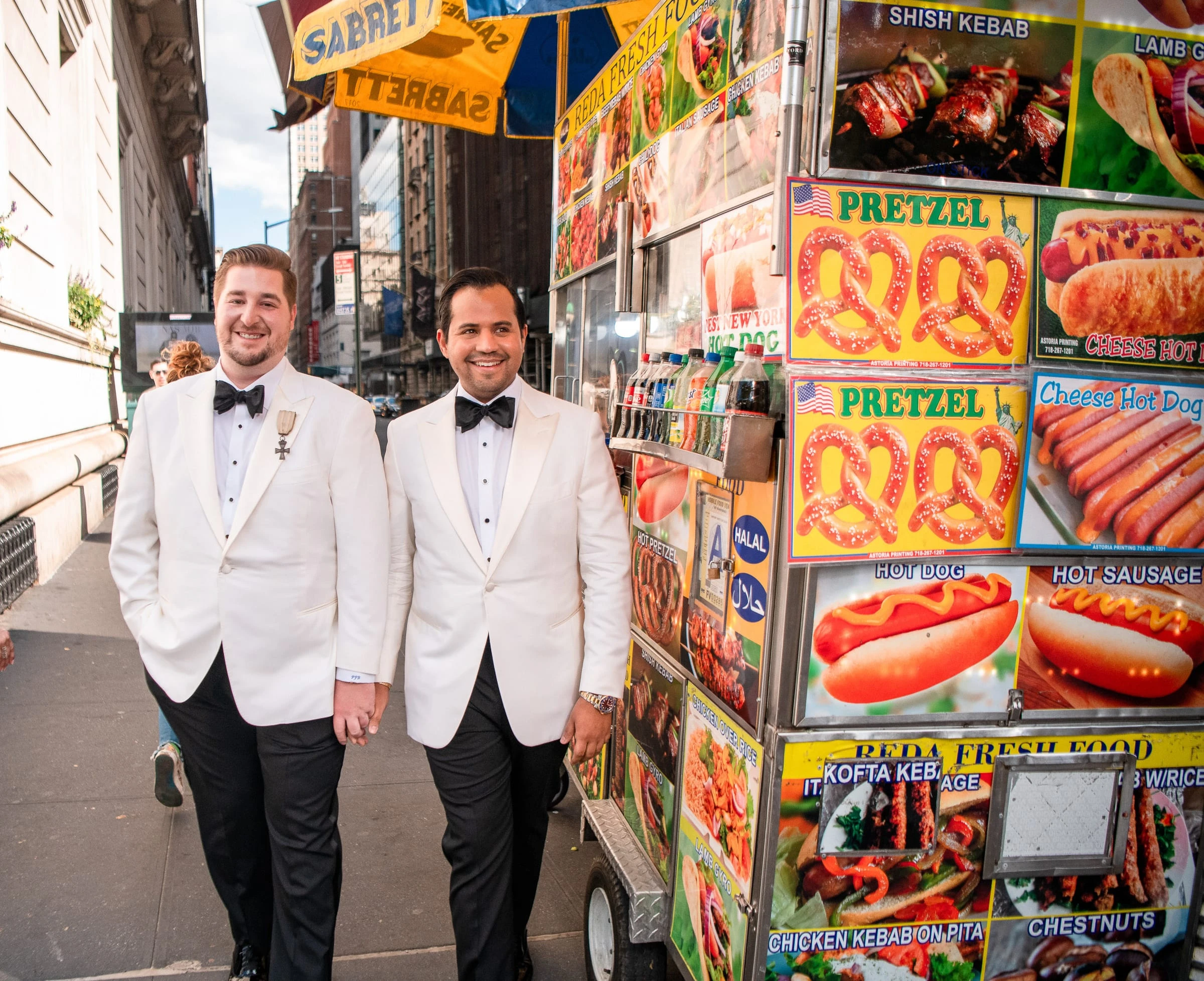 The grooms walking past a street food cart — Metropolitan Club, New York