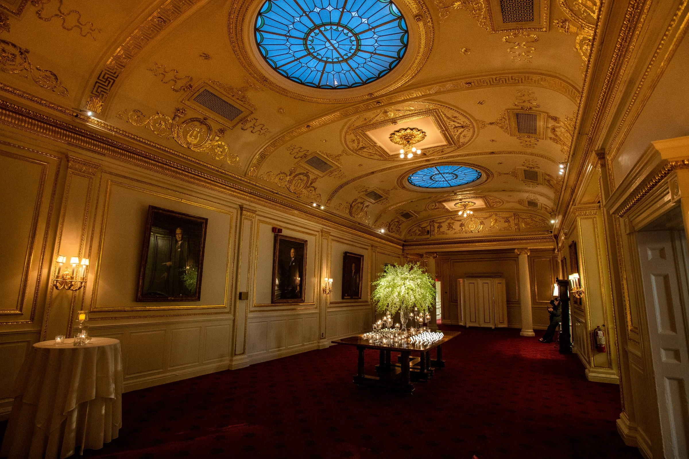 The gilded hall with its blue skylights before the guests arrive — Metropolitan Club, New York