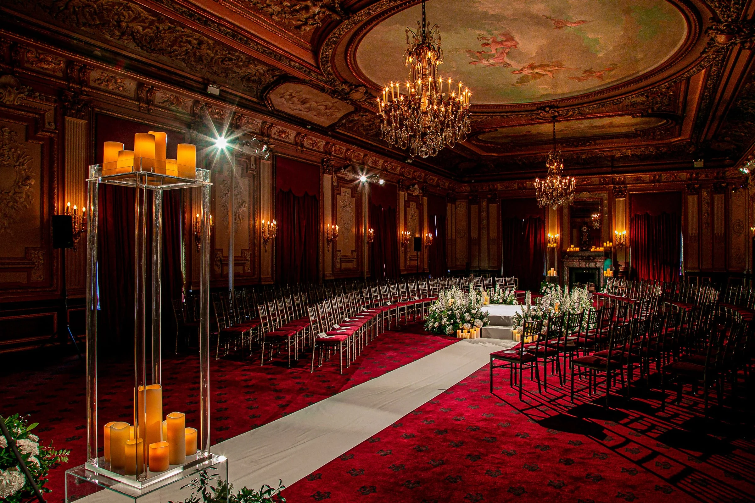 The ceremony room set with pillar candles down the aisle — Metropolitan Club, New York