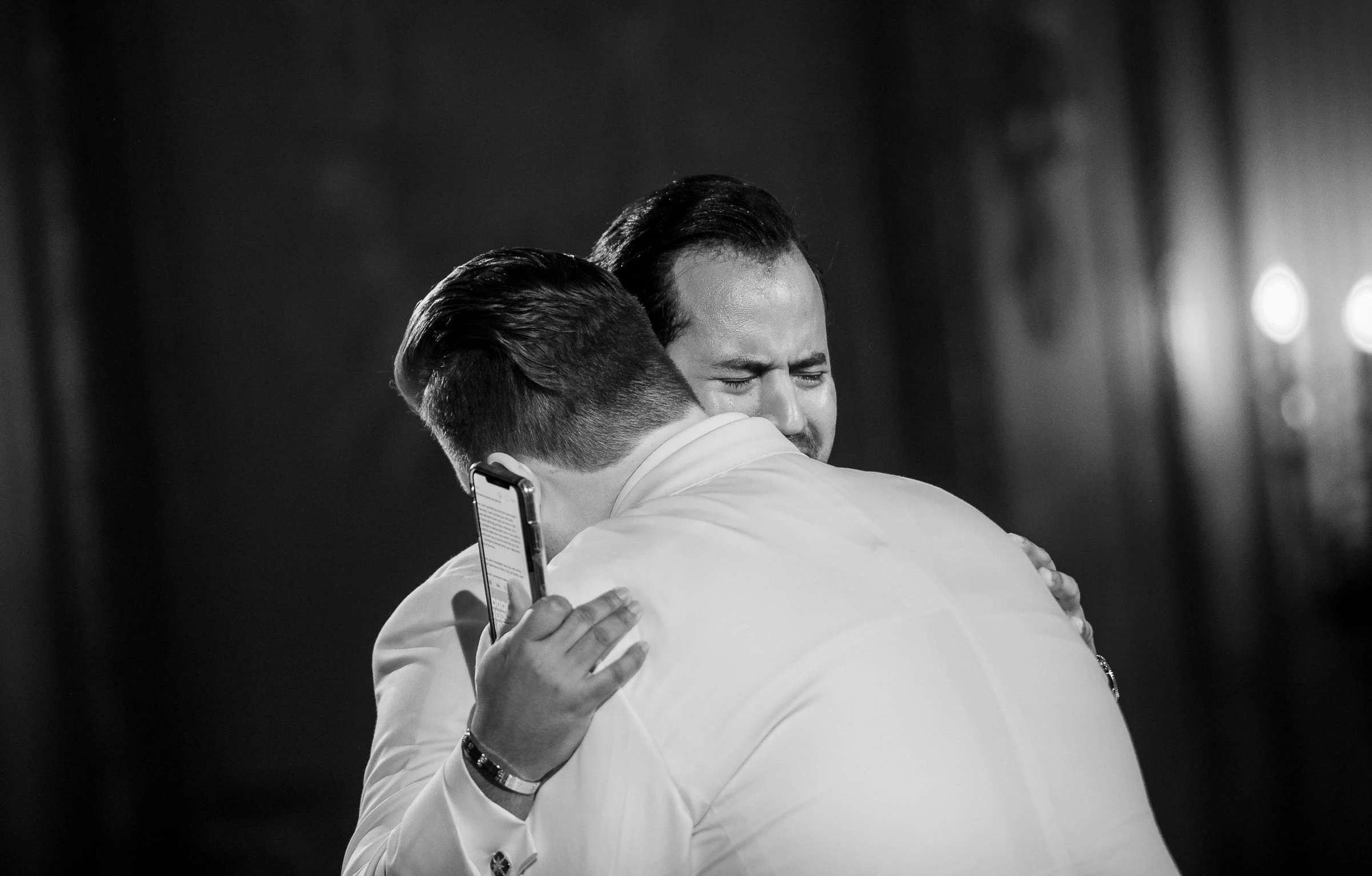 An embrace during the ceremony, in black and white — Metropolitan Club, New York