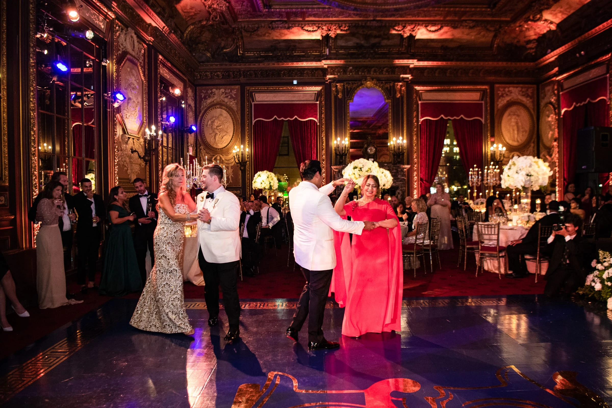 Guests dancing in pairs on the ballroom floor beneath the gilded walls — Metropolitan Club, New York