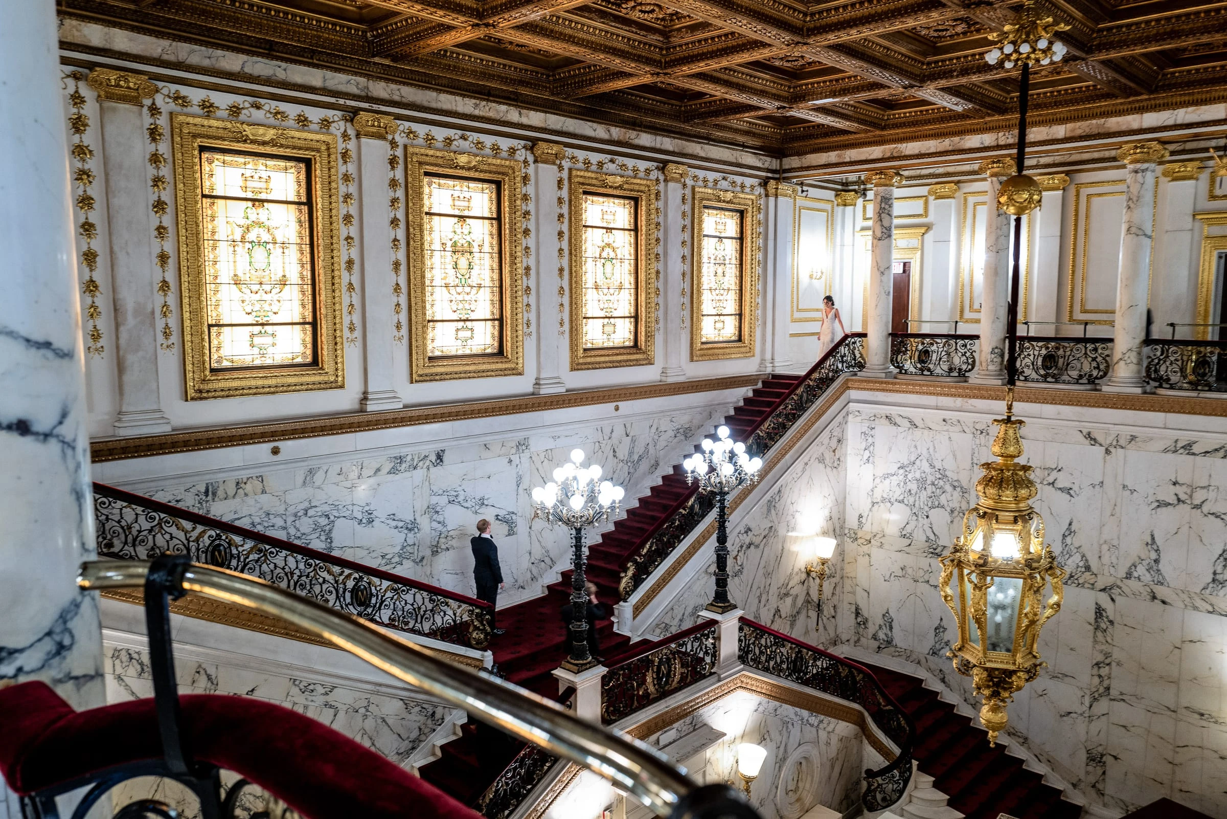 The marble stair hall under its stained glass and gilded ceiling — Metropolitan Club, New York