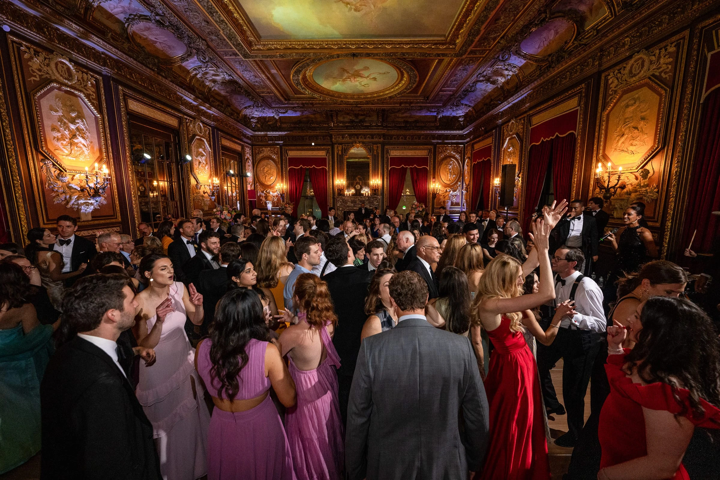 A full dance floor beneath the ballroom's painted ceiling — Metropolitan Club, New York