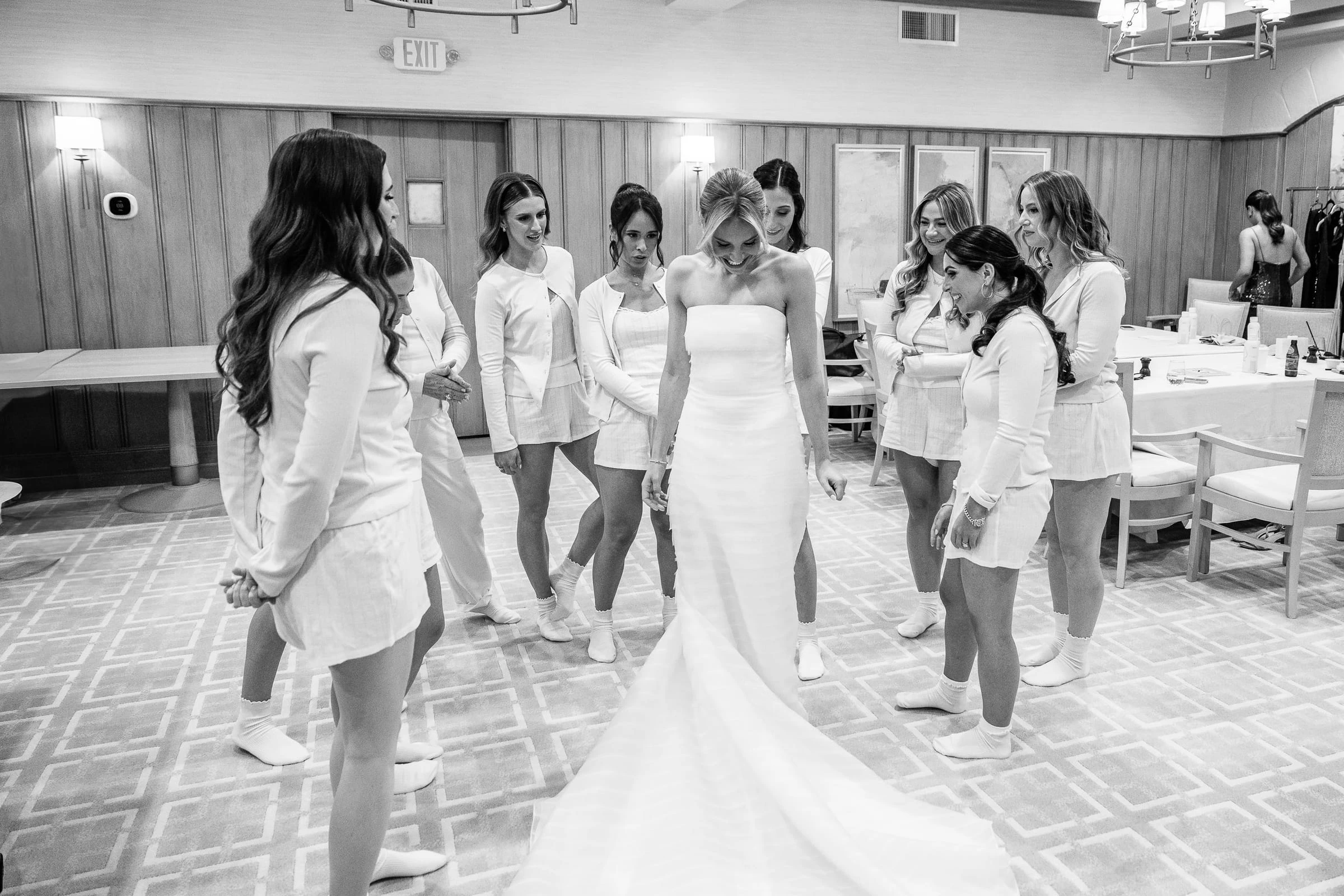 The bride in her gown surrounded by her bridesmaids, in black and white — Mountain Ridge Country Club, West Caldwell