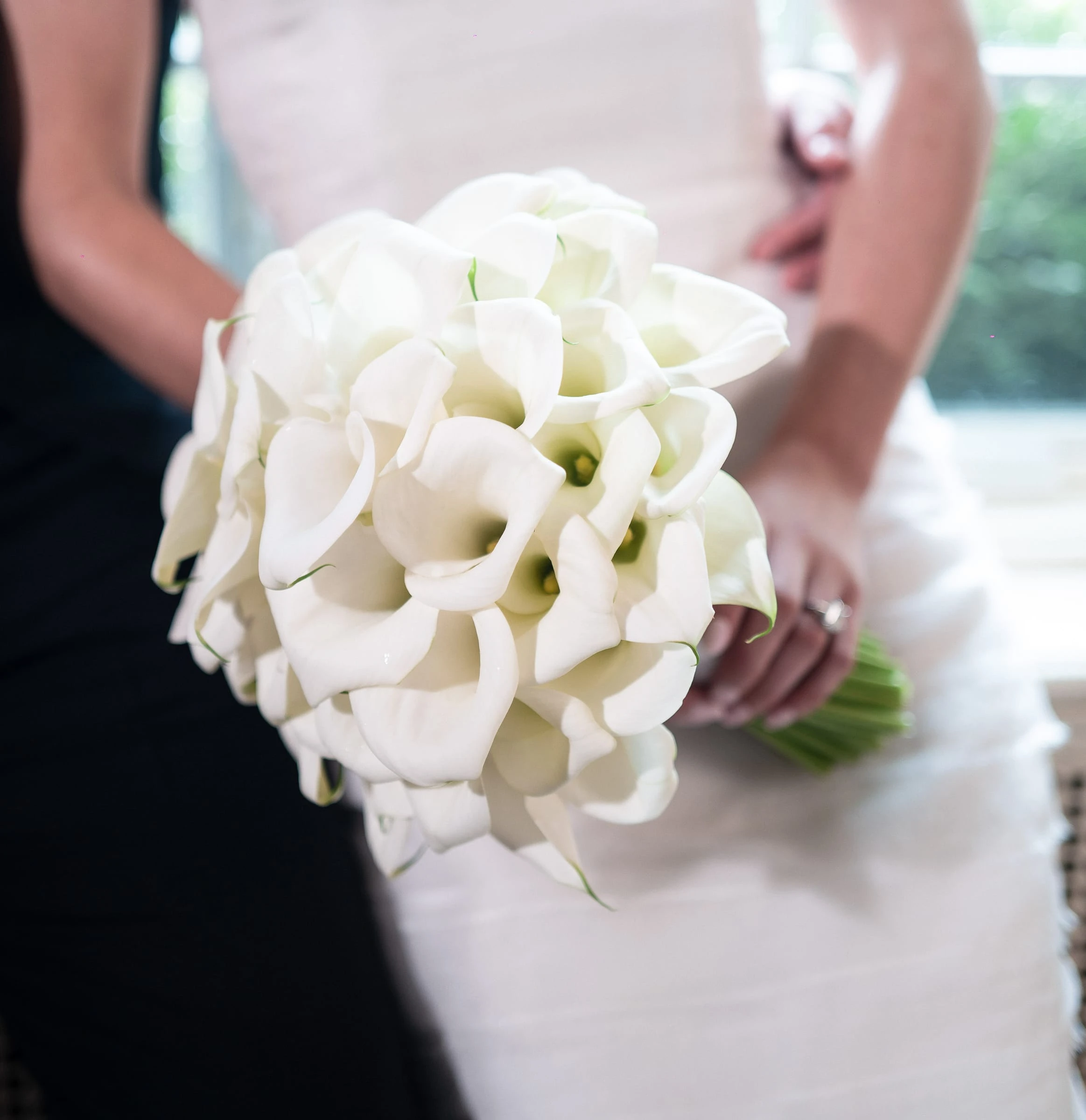 A close view of the bride's calla lily bouquet — Mountain Ridge Country Club, West Caldwell