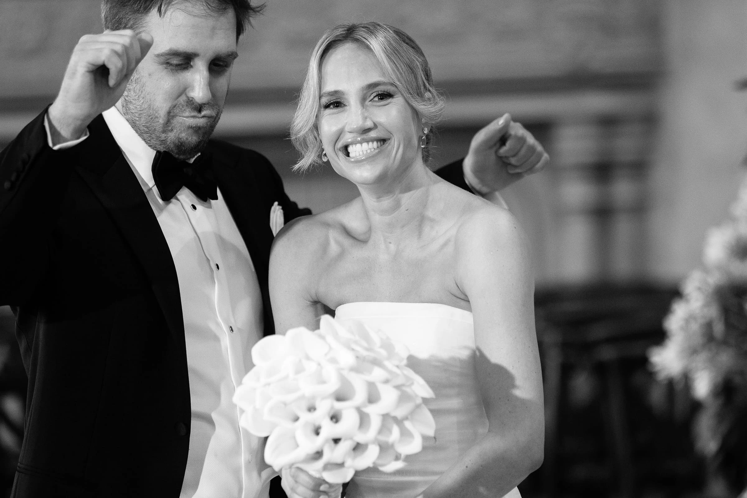 The groom clowning beside the laughing bride, in black and white — Mountain Ridge Country Club, West Caldwell