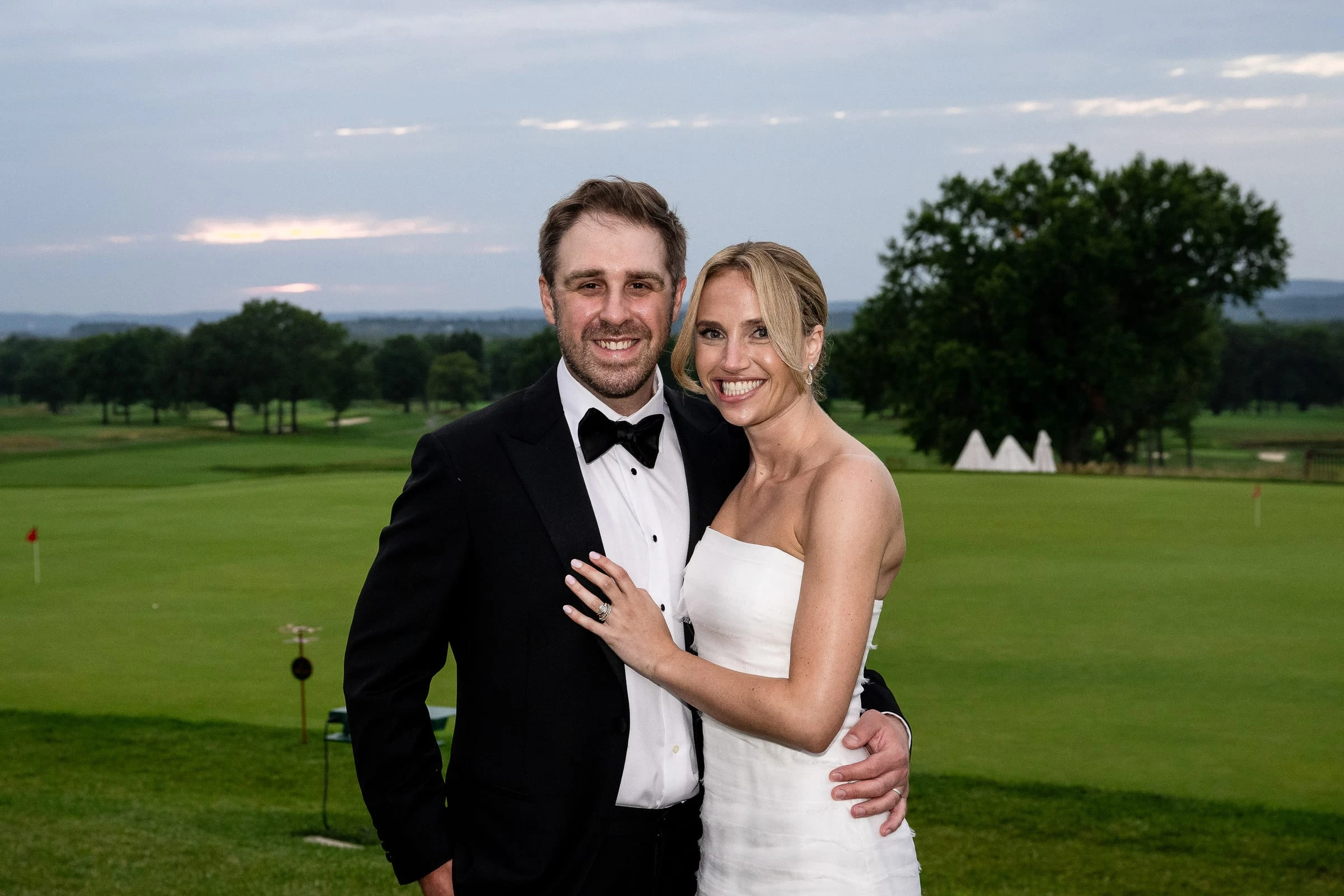 The couple together on the fairway at dusk — Mountain Ridge Country Club, West Caldwell