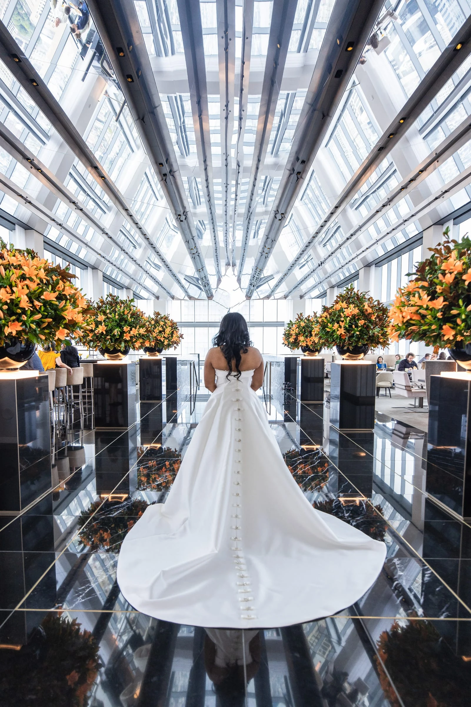The bride and her train reflected in the mirrored floor of the atrium — Philadelphia Museum of Art, Philadelphia