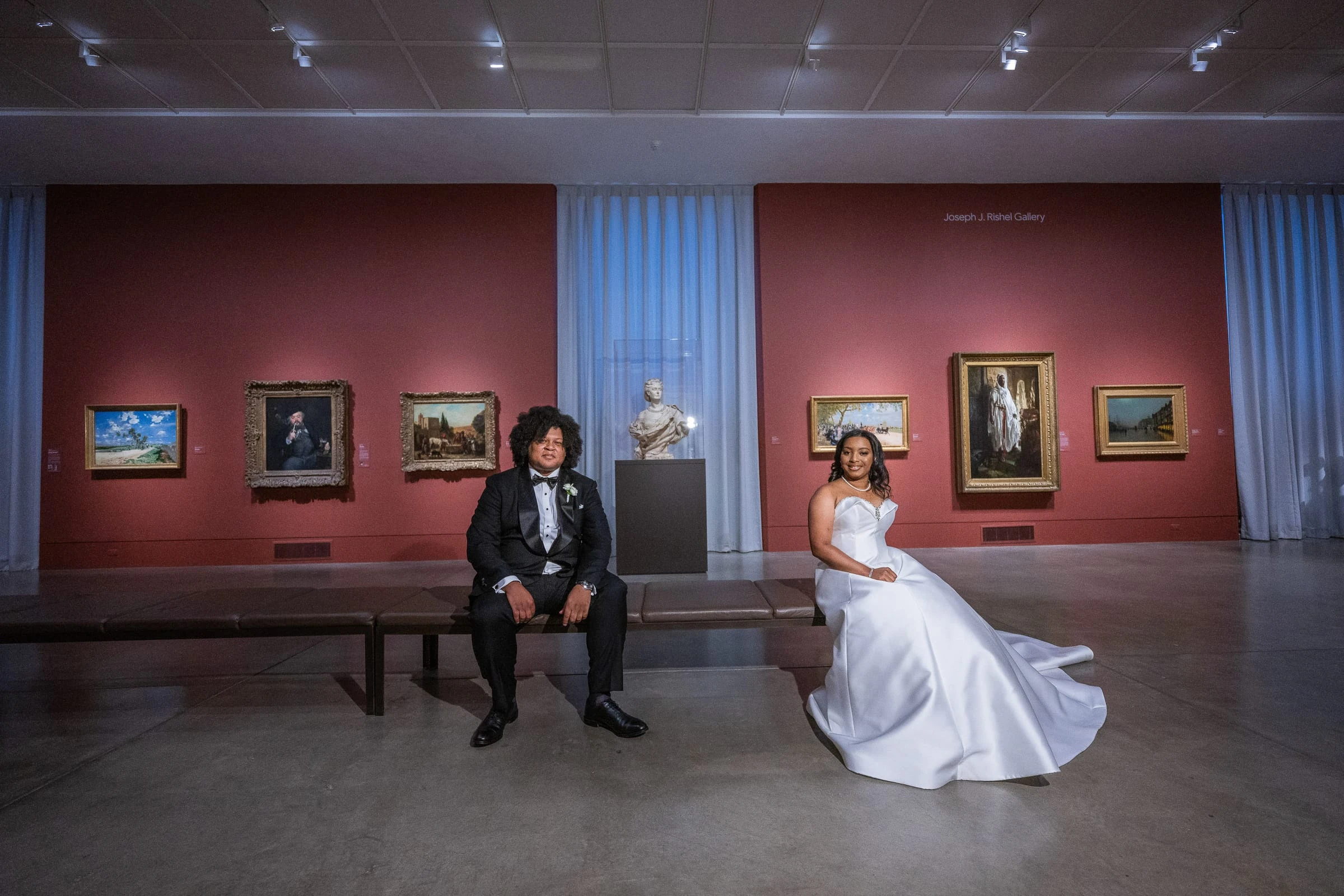 The couple in a red gallery hung with paintings — Philadelphia Museum of Art, Philadelphia