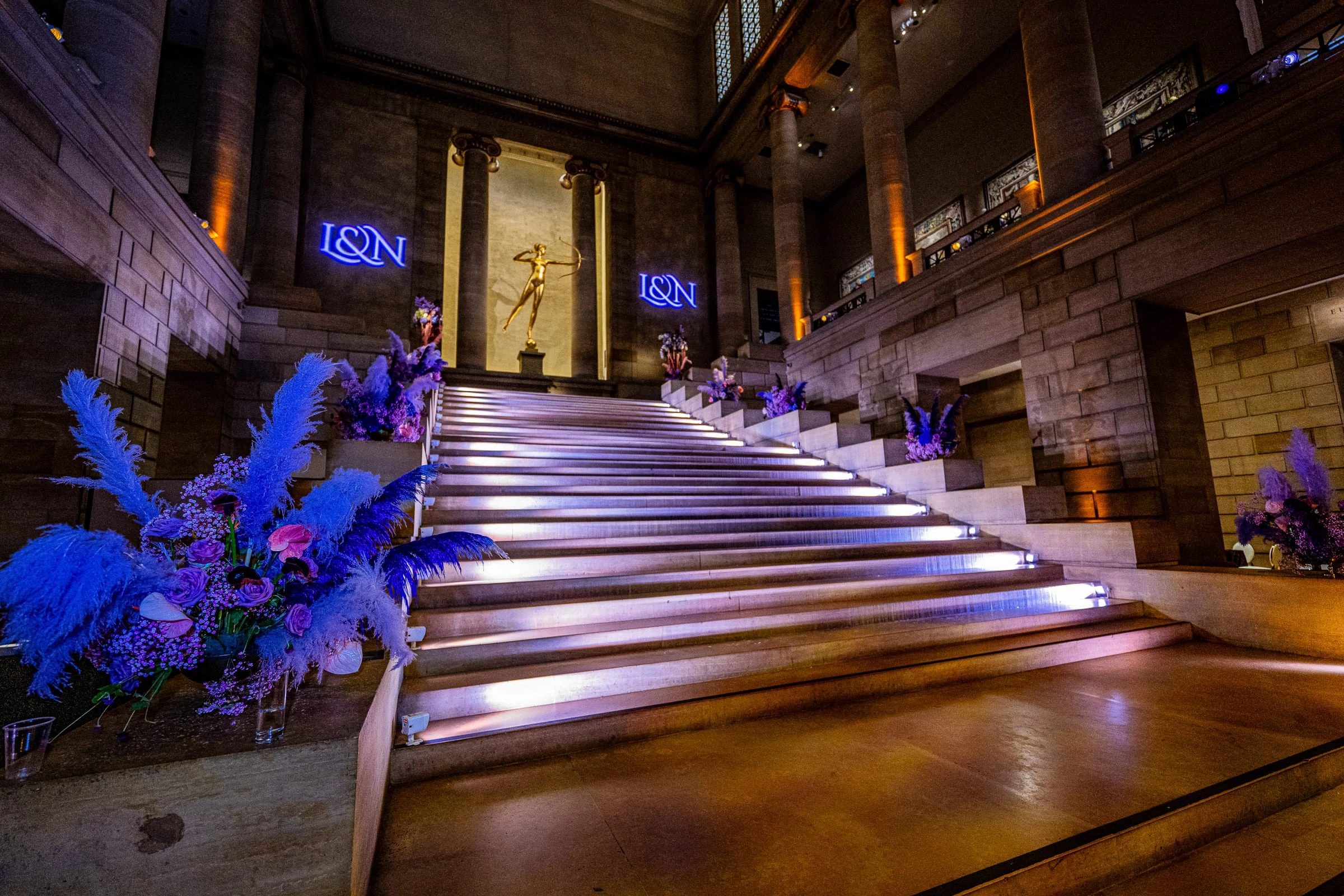 The staircase dressed with purple feathers and lit from below — Philadelphia Museum of Art, Philadelphia